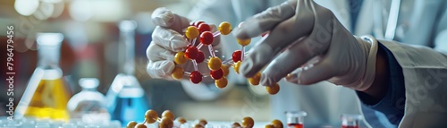 Close-up of scientists hands conducting drug synthesis experiment, molecular model and copy space photo