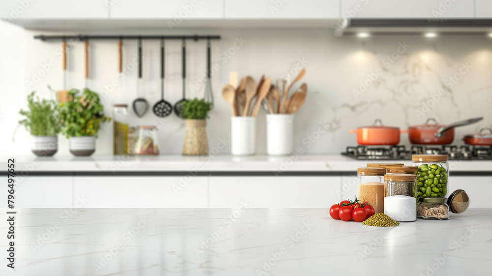 Kitchen table with various spices and kitchen utensils on blurred modern kitchen background. Copy space Kitchen table with various spices and kitchen utensils on blurred modern kitchen background. Copy space