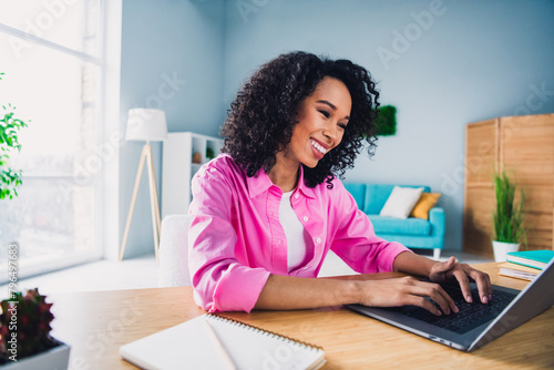 Photo of pretty young girl make notes online lecture entrepreneur wear trendy pink outfit modern interior indoors office workstation