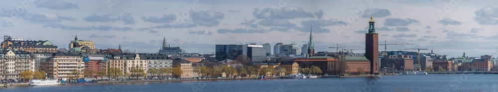 Fototapeta premium The district Kungsholmen, the City Hall, and down town at the bay Riddarfjärden, a sunny spring day in Stockholm 