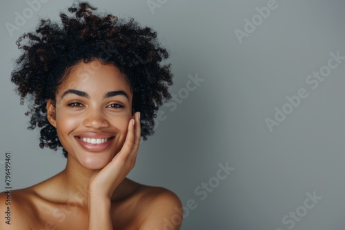 Hair, beauty, and portrait of black woman smiling for health, growth, and shine on gray background. Skincare, luxury salon, cheerful girl with makeup, self-care, and face treatment
