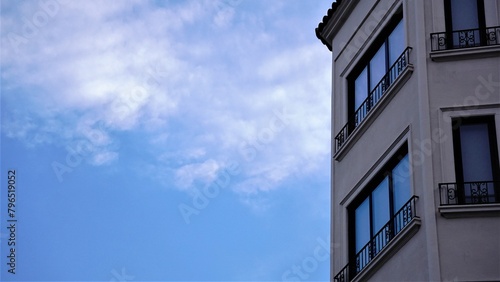 urban residential building facade profile against blue sky