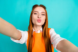 Photo of lovely pretty adorable girl wear trendy orange outfit isolated on cyan color background