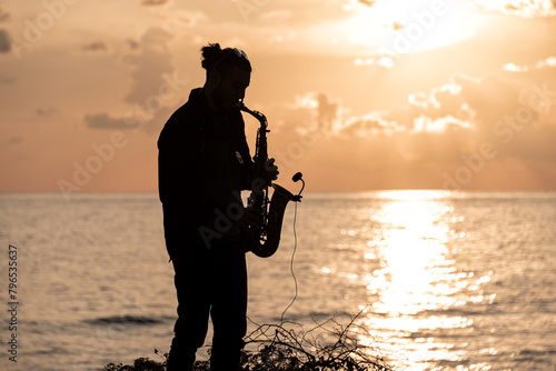 Photography Man playing the Saxophone at sunset