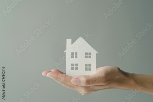 A house paper cut model hand holding finger.