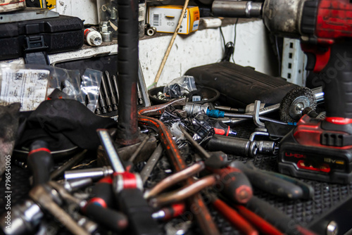 Garage. Car repair. Tools. Rubber tires, wheels.