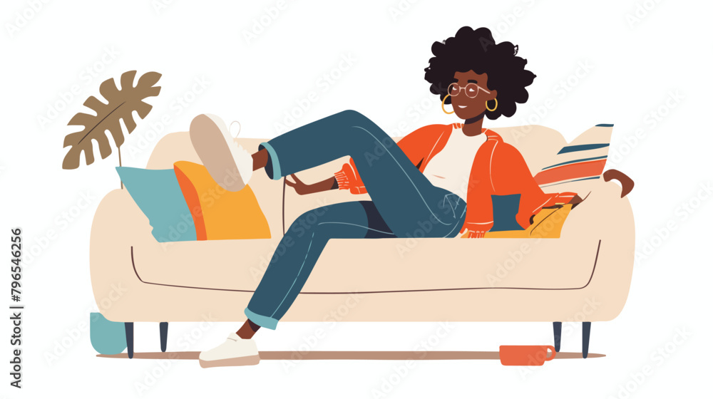 African-American teenage girl relaxing on sofa at hom