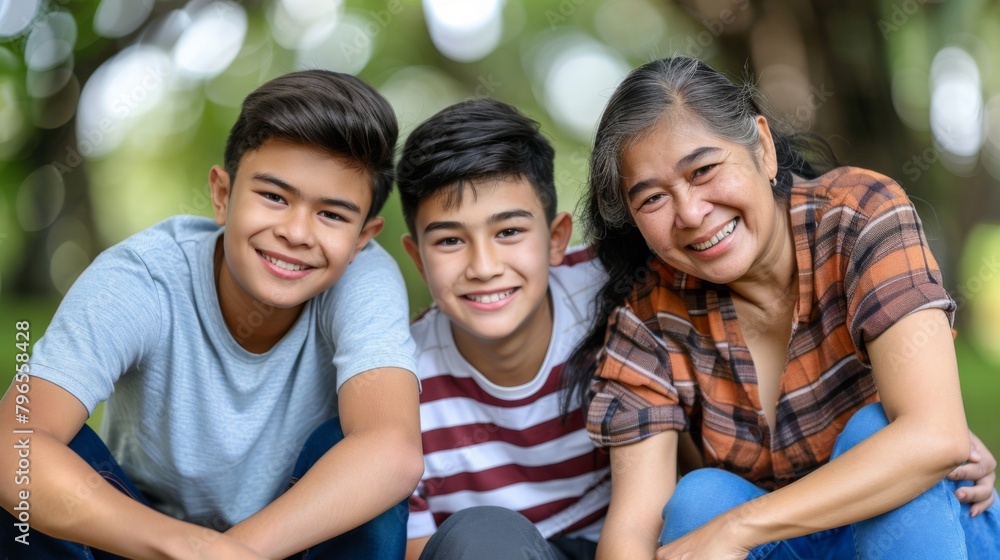 Smiling Multi-Generational Asian Family Enjoying Outdoor Park