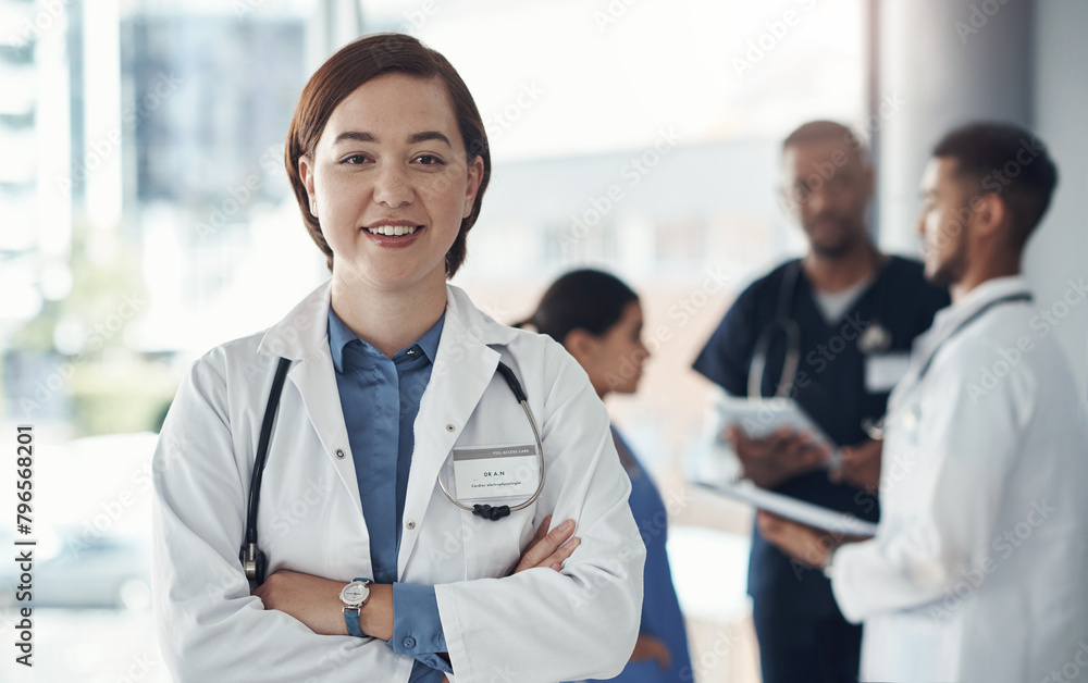 Doctor, portrait and arms crossed in hospital or medical meeting with confidence, integrity and about us. Face of healthcare worker in leadership and happy for support, advice and planning in clinic Doctor, portrait and arms crossed in hospital or medical meeting with confidence, integrity and about us. Face of healthcare worker in leadership and happy for support, advice and planning in clinic
