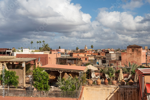 A panoramic view over the fortified ancient city of Marrakech, Morocco in the late afternoon sun. © parkerspics