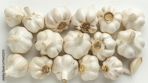 Top view of fresh garlic bulbs, emphasizing the allicin compound, associated with immune and heart health benefits, on an isolated background, studio lighting