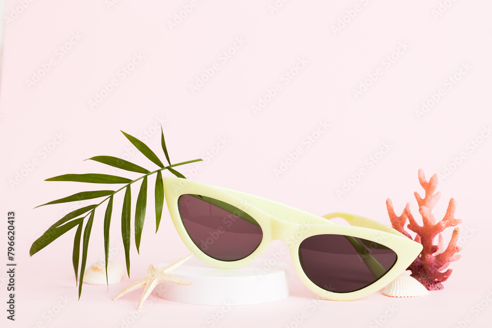 sunglasses with seashell lying on table background. Sunglasses on summer background. Top view flat lay with copy space for text sunglasses with seashell lying on table background. Sunglasses on summer background. Top view flat lay with copy space for text