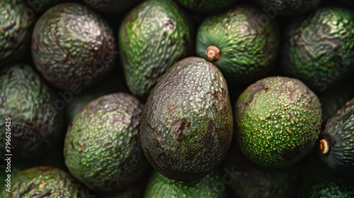 Detailed top view of ripe avocados, focusing on the textures and natural sheen, packed with vitamins and healthy fats, against an isolated background photo