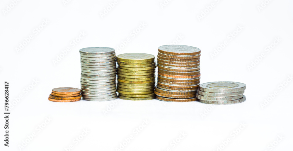 Many Thai baht coins arranged in neat layers on a white background, isolated Many Thai baht coins arranged in neat layers on a white background, isolated