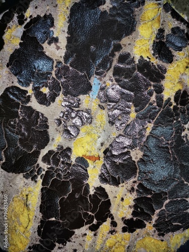 Peeling faux leather couch. A close-up of a damaged Gray faux leather.torn car cushion.Showing to the Gray leather car seat damaged corner. Problem Car seat cracking.