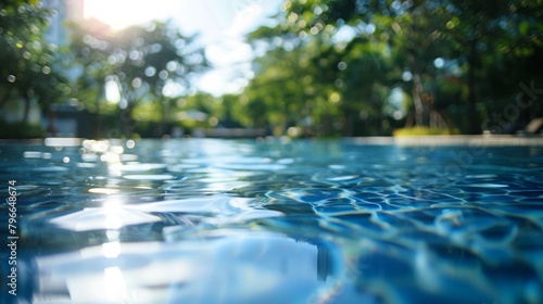 The hustle and bustle of the city fades into a blur as the focus shifts to a sparkling pool surrounded by trees and the sky creating a peaceful oasis in the midst of the urban chaos. .