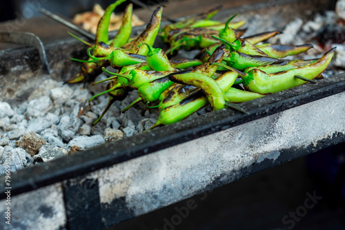 Delicious green peppers on bbq in a food festival in the city of Adana, close up, outdoor photography