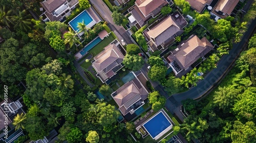 A view of a neighborhood with houses and a pool © Hope