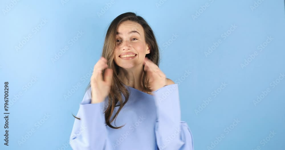 This is me? Wondered woman with brunette hair in pullover pointing herself, looking surprised shocked by personal achievements, amazed at own success isolated on blue background. Woman show wow sign. This is me? Wondered woman with brunette hair in pullover pointing herself, looking surprised shocked by personal achievements, amazed at own success isolated on blue background. Woman show wow sign.