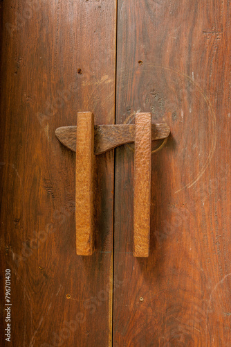 Old dark brown wooden door with lock photo