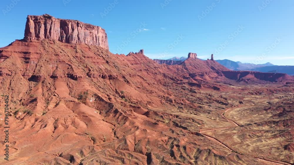High spires red rock pinnacle butte in valley of Colorado river Usa. Foothills with rugged terrain formed by geological process formed rock structure. Aerial explore remote area, craving adventure High spires red rock pinnacle butte in valley of Colorado river Usa. Foothills with rugged terrain formed by geological process formed rock structure. Aerial explore remote area, craving adventure