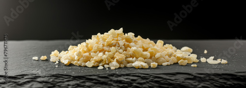 Yellow crystals of MDMA on black surface