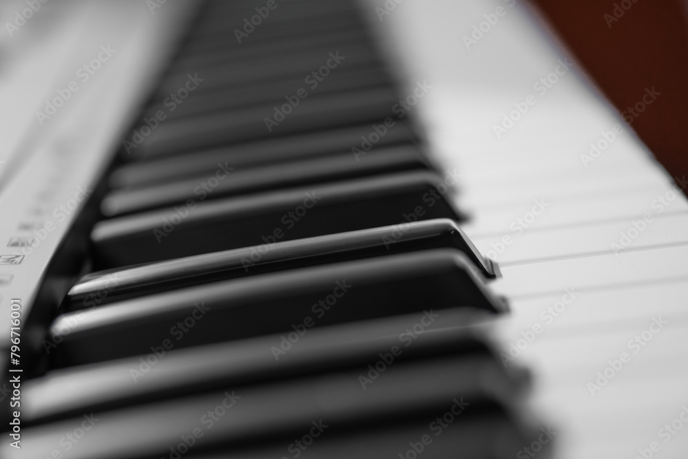 piano keys, blurred background in the distance piano keys, blurred background in the distance