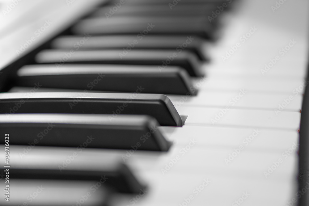 piano keys, blurred background in the distance piano keys, blurred background in the distance