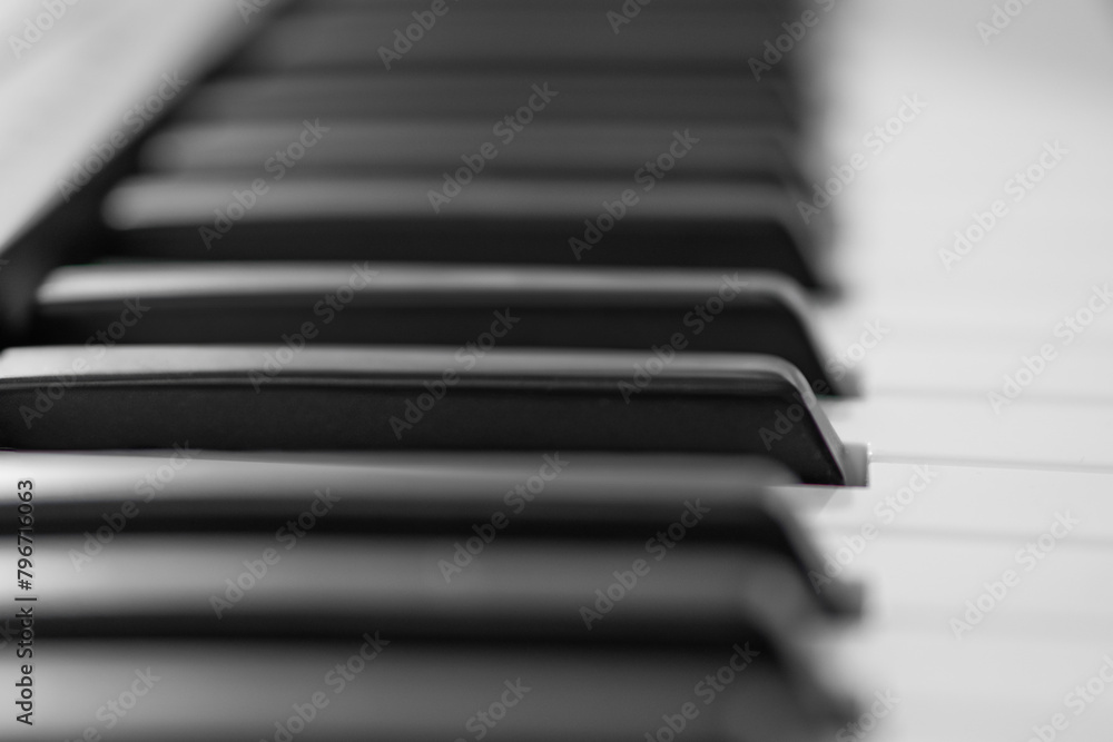 piano keys, blurred background in the distance piano keys, blurred background in the distance