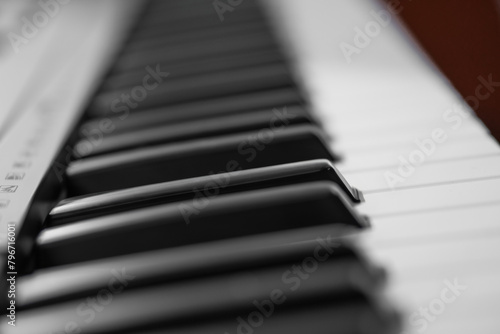 piano keys, blurred background in the distance photo