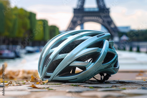 bicycle helmet resting on paris street with eiffel tower silhouette, olympic games concept