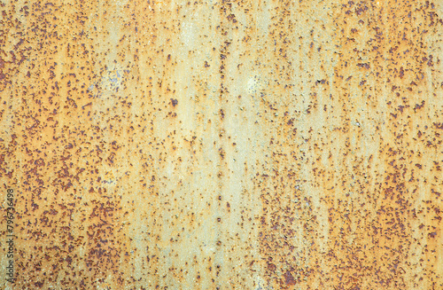 Paint peeling crackling off brown rusty metal texture background. Green paint peeling off rusty metal background. Design element.