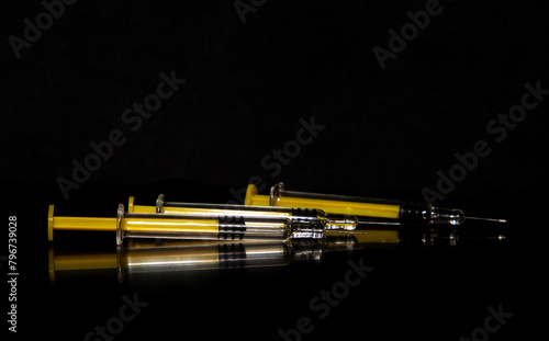 Empty syringes on a black background
