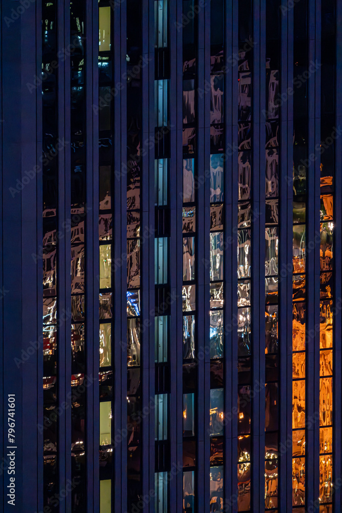 Skyscraper glass facade reflecting at night Skyscraper glass facade reflecting at night
