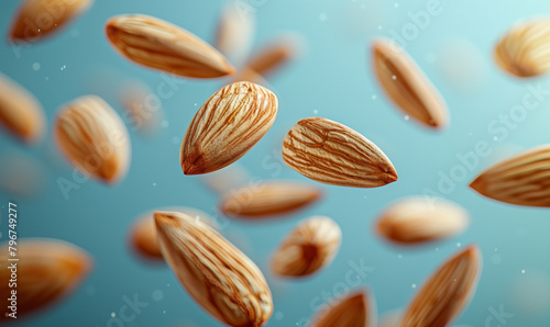 Almond nuts falling or flying in air in realistic closeup shot background for advertising banner. Roasted almonds nuts explosion splash falling or floating in macro close up for product ad poster