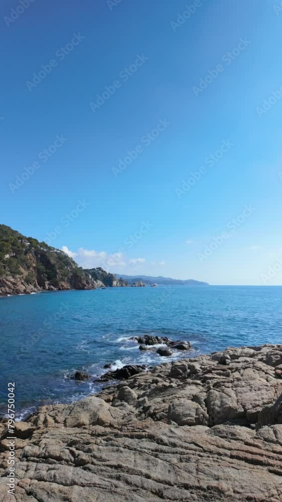 Vertical video of a beach in the Mediterranean blue sea, turquoise, sky, copy space Vertical video of a beach in the Mediterranean blue sea, turquoise, sky, copy space