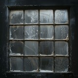 b'Black wooden framed window with dirty glass panes'