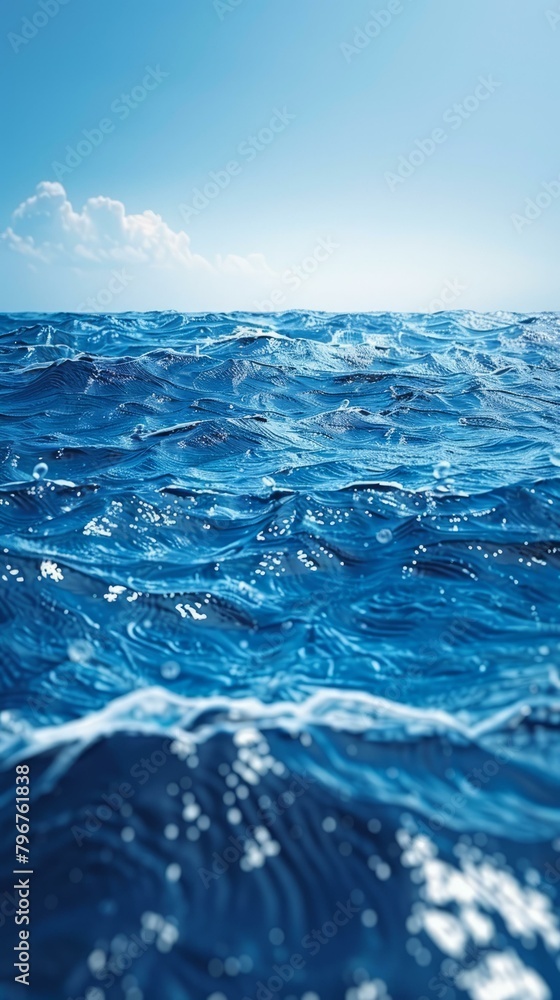 b'Deep blue ocean surface with white clouds in the background' b'Deep blue ocean surface with white clouds in the background'