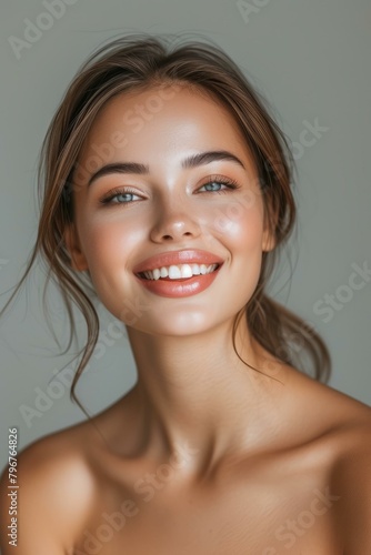 b Close up portrait of beautiful smiling young woman with perfect skin 