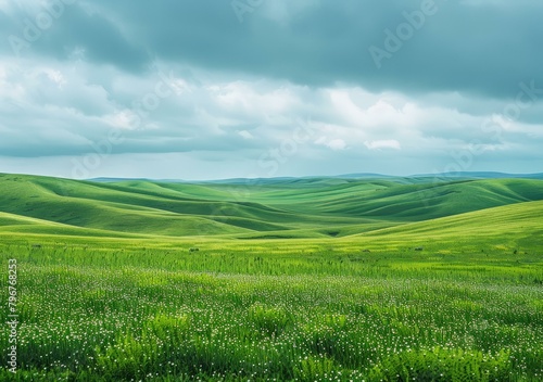 b'Green rolling hills under a cloudy sky'
