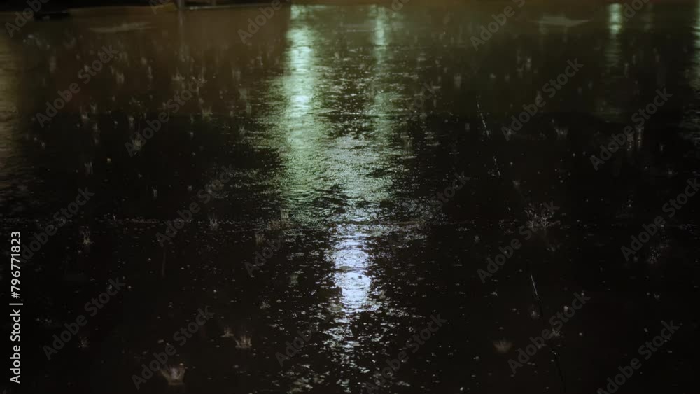 hail falling during violent storm on parking lot at night time. Close up shot hail falling during violent storm on parking lot at night time. Close up shot