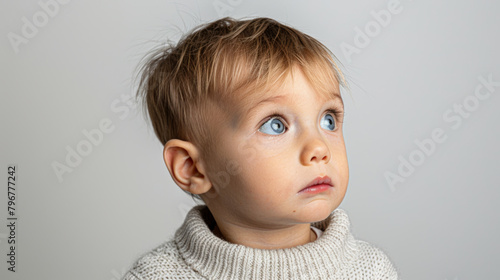 baby with Confusion: Furrowed brow, puzzled expression, lost in a labyrinth of uncertainty photo