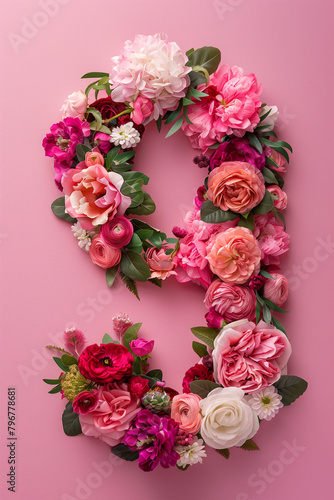 Vertical Pink Floral Number Nine. Top view of number 9 floral arrangement on pink background for celebrations.