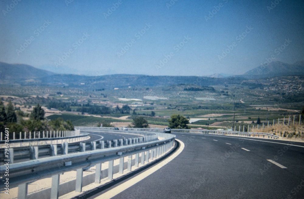close up of the autobahn highway in Greece, with mountains in the background close up of the autobahn highway in Greece, with mountains in the background