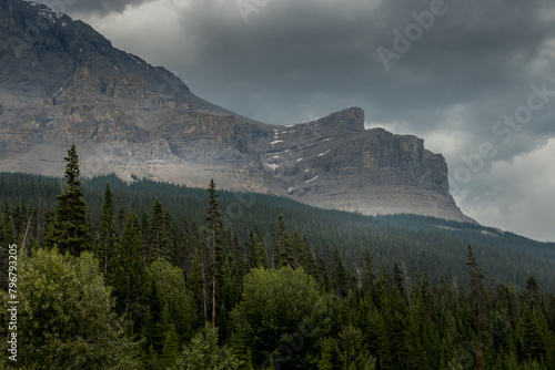 Storm clouds and rain fall over the Rockies Ice Fields Parkway Banff National Park Alberta Canada photo