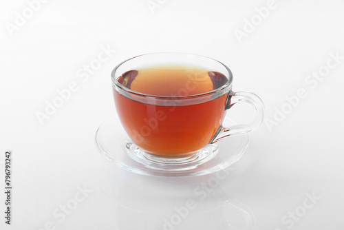 Tasty tea in cup on white background