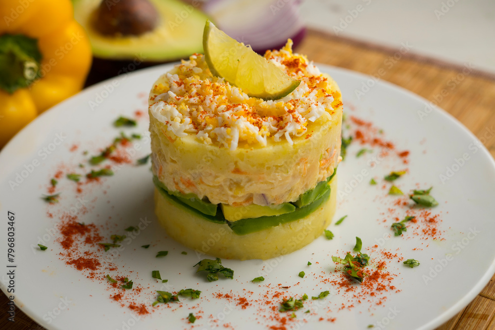 Causa Peruana. Causa Lima is a traditional starter of Peruvian cuisine made with potato, avocado, chicken or tuna. Causa Peruana. Causa Lima is a traditional starter of Peruvian cuisine made with potato, avocado, chicken or tuna.