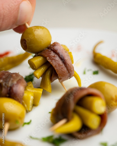 Gilda is a traditional pincho or tapa from the Basque Country that is prepared with anchovies, olives and pickled chillies.