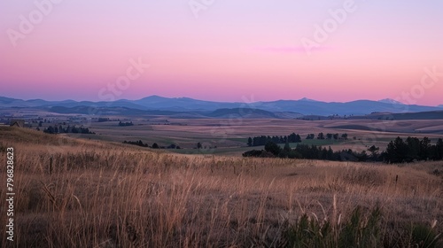 Patches of light peach and mauve dot the landscape as the sun sinks lower creating a sense of tranquility and calm..