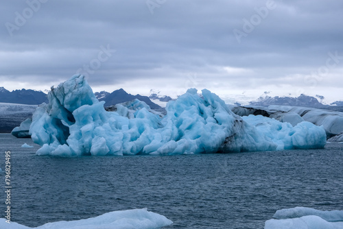 Water and ice lake with snow-capped mountains in the background on Jökulsárlón glacier, Iceland